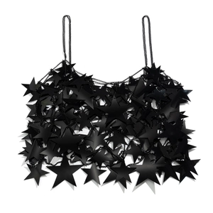 Detail of sexy black star sequin body chain with intricate metal link tassels