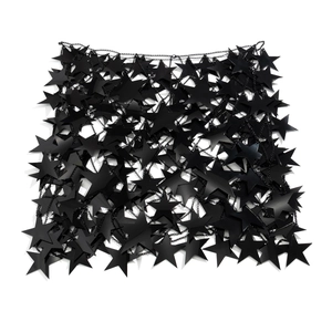 Detail of black sequin star chain skirt with intricate hollow mesh link structure