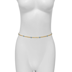 Detail of bohemian gold waist chain with blue daisy bead charms on a white mannequin