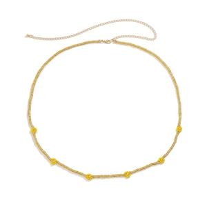 Close-up of handmade daisy waist chain with colorful beads and adjustable lobster clasp