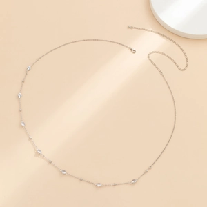 Close-up of double-layer silver body chain with sparkling crystal accents and clasp