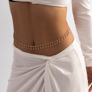 Women's gold waist chain with clear rhinestone tassels for a stylish beach accessory