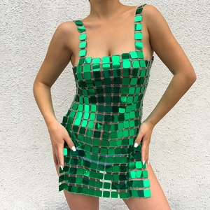 Detail of vibrant green metallic sequin mesh fabric on a sexy backless party dress