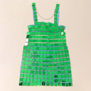 Detail of emerald green metallic sequins and silver chain link on a party dress