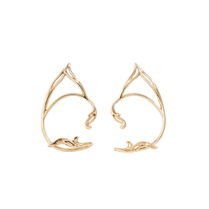 Detailed view of golden hollow cat-ear elf ear cuffs with vintage scrollwork patterns