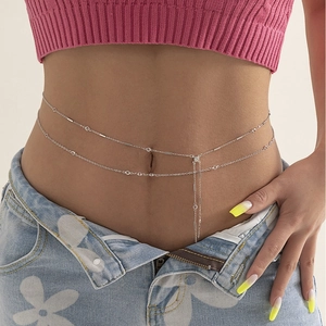 Stylish silver double-layer waist chain with crystal pendant on a female model