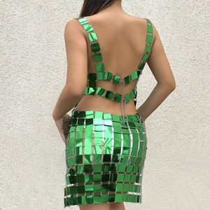 Detail of green sequin bikini set featuring metallic chain links and reflective finish