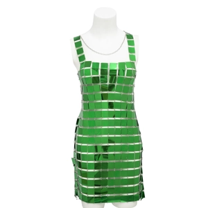 Detailed close-up of emerald green sequins linked by small metal rings on a party dress