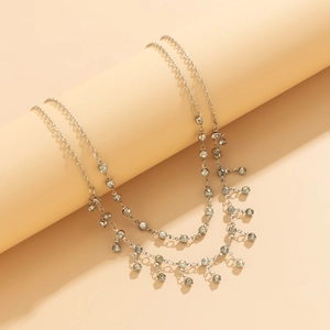 Detail showing shiny silver double-layer tassel chain with sparkling crystal rhinestones