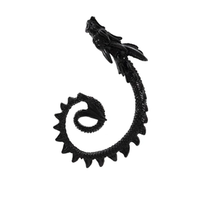 Macro detail of punk style black dragon ear cuff with detailed scales and polished finish