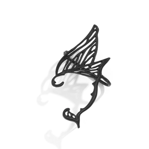 Detail of gothic black elven ear cuff with intricate hollow wing design and matte finish