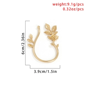 Macro view of gold rose leaf ear cuff with specific dimensions 6cm by 3.9cm