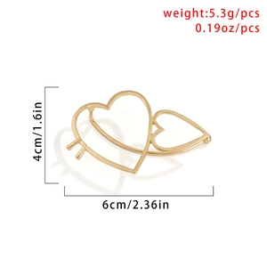 Detailed view of triple gold heart-shaped hair clips with product dimensions and weight