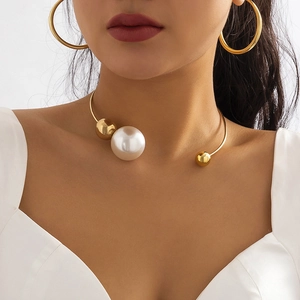 Minimalist asymmetric gold choker with a large white pearl and polished golden beads