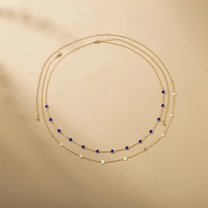 Double-layer gold body chain with blue gemstones and sparkling round sequins