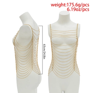Detailed view of layered gold body chain with tassel design on a white mannequin