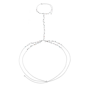 Detail of silver body chain with colorful beads and butterfly charms on white background
