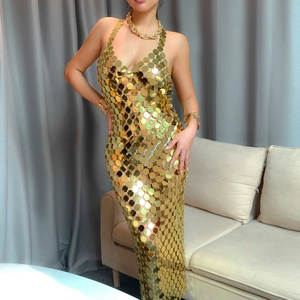 Sexy gold sequin halter dress with open back and metallic chain jewelry for party wear