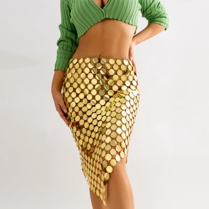 Detail of gold sequin body chain skirt featuring metal discs and asymmetric mesh design