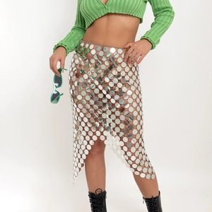 Close-up of silver sequin tassel skirt with metallic link grid and shimmering disc detail