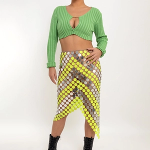 Detail view of colorful metallic sequins on an asymmetrical wrap beach mini skirt
