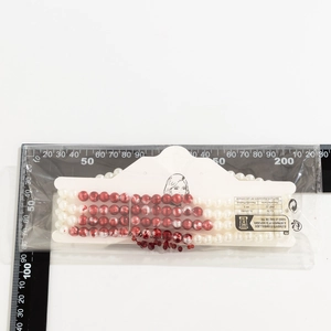 Gothic pearl choker with red drip fringe shown with scale ruler for size reference