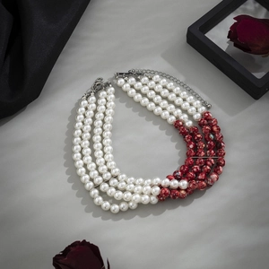 Macro detail of gothic four-layer beaded choker with red blood-drop pearls and silver clasp