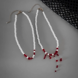 Detail of gothic choker set with red crystal blood drops and white faux pearls