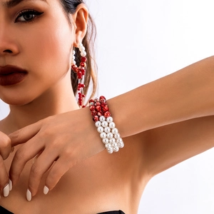 Detail of gothic beaded choker set with white pearls and red marble droplets