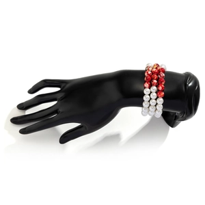 Detail view of gothic triple-layer pearl bracelet with red beaded blood drip accents