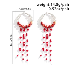 Macro detail of gothic pearl choker with red blood drop tassels for Halloween party
