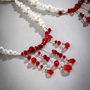 Detail of gothic choker with white faux pearls and red blood-drip crystal tassels