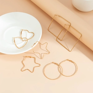 Set of five gold geometric hoop earrings with heart, star, and textured hammered finish
