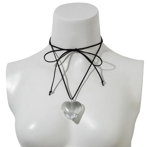 Detail of adjustable black wax cord choker with a faceted clear heart pendant on a bust