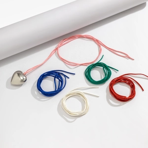 Detailed set of silver heart pendant with five colorful adjustable velvet cords in various tones
