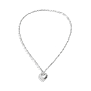 Detail of silver heart pendant necklace with polished mirror finish and velvet chain