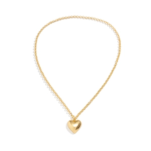 Close-up of a polished gold heart pendant with mirror finish on a sleek metal chain