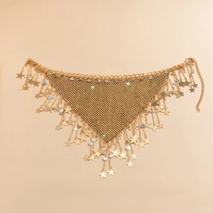 Detail of gold star pendants and iridescent sequins on a mesh bikini body chain