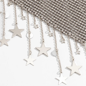 Detailed view of silver mesh body chain featuring sparkling rhinestones and star charms