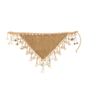 Detail of golden mesh body chain featuring star pendants and blue sequins decoration