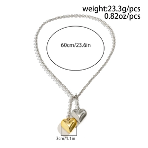 Detail showing two-tone heart pendants and 60cm chain dimensions of the choker necklace