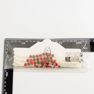Multi-layer Christmas choker with white pearls and red green beads on packaging card