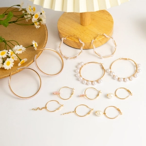 French vintage gold hoop earrings set with faux pearls, heart and star charms