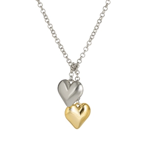 Detail of metallic double heart pendants in gold and silver with polished mirror finish