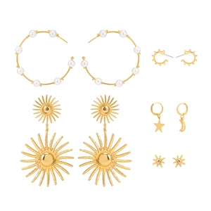 French vintage gold earring set featuring faux pearls, star, and sunburst pendant designs