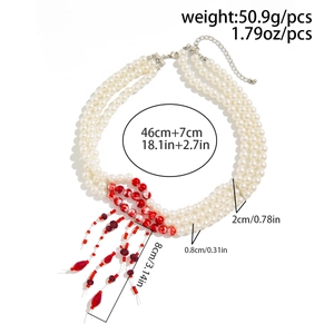 Detailed view of layered pearl choker with red drip charms and size measurements