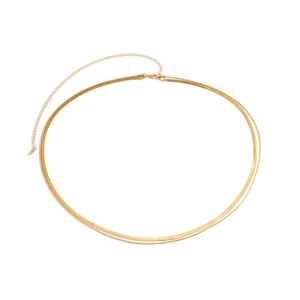 Detail of golden double-layer snake chain waist belt with lobster clasp closure
