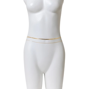 Detailed view of a gold double-layer snake chain and cross tassel belly chain for women