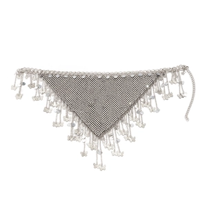 Detail of silver body chain featuring mesh diamonds, fringe tassels and butterfly charms