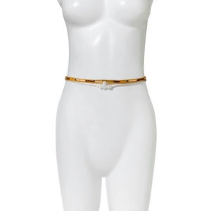 Detail of layered waist beads with brown beads and white pearls for beach vacation style
